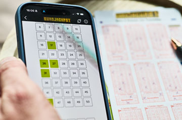 Smartphone, auf dem Eurojackpot-Zahlen angewählt sind.