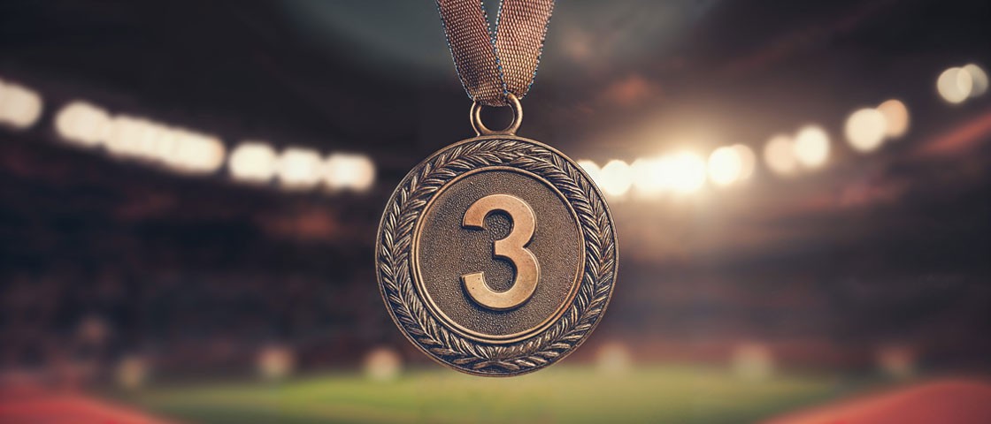 Die Zahl drei auf einer Medaille WestLotto Glückszahlen